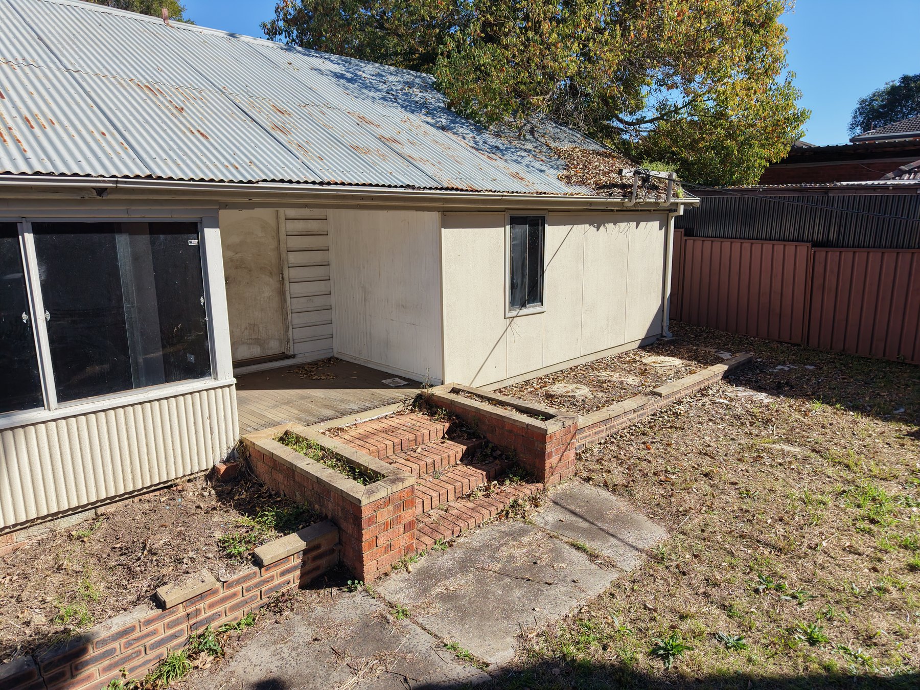Entrance steps and windows of the existing building
