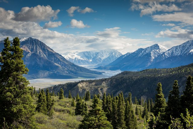 Snow-capped mountains above a green valley