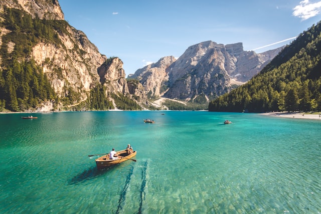Boats on a turquoise mountain lake