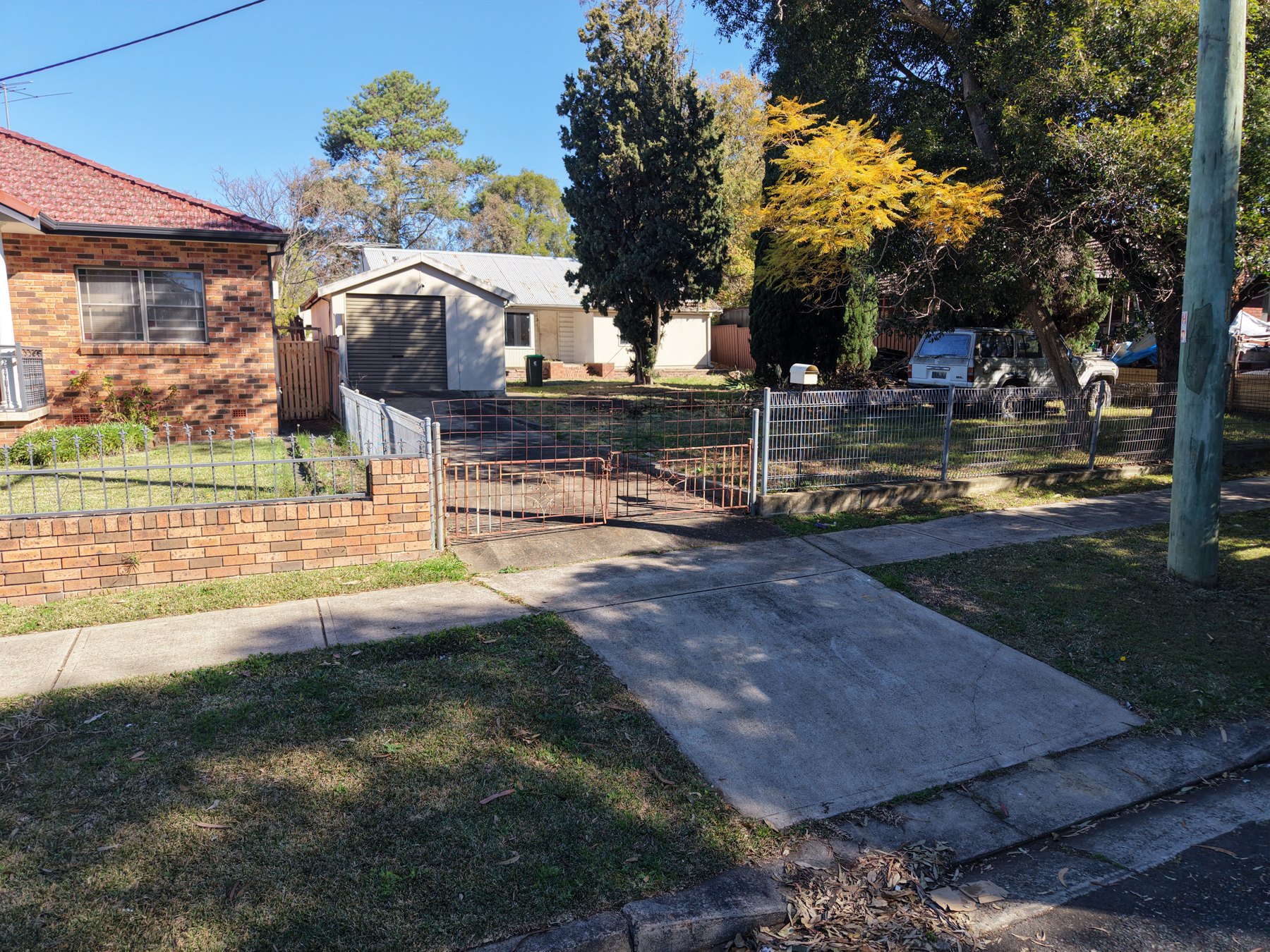Street-side view of the property entrance and building